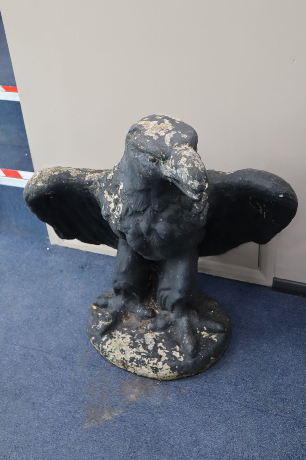 A pair of reconstituted stone eagle garden ornaments, height 78cm